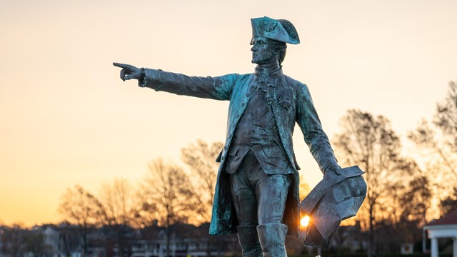 Rochambeau Statue pointing out at sunset