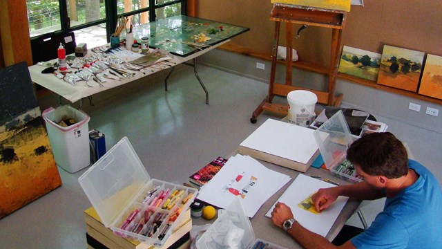 Former Artist in residence working on projects in the studio 