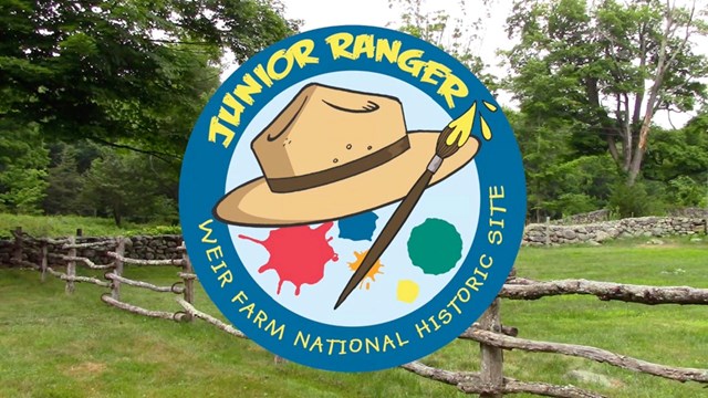 A graphic of a ranger hat with a paintbrush that says in front of a photo of a green meadow.