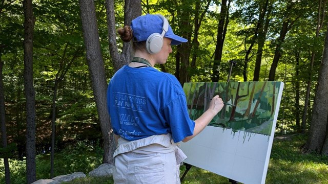 Artist in Residence painting outdoors at Weir Farm NHP