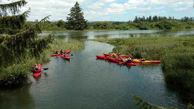 kayakers rest in a offshoot of a river
