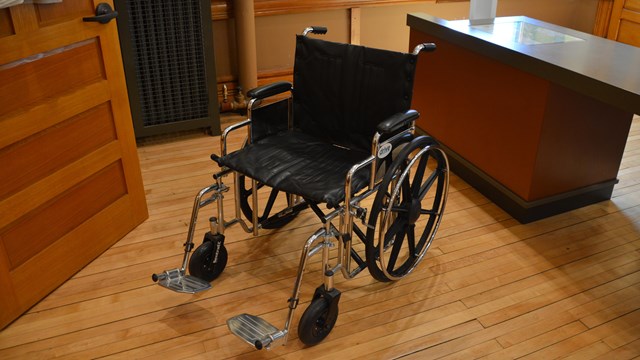 An empty wheelchair in a room.
