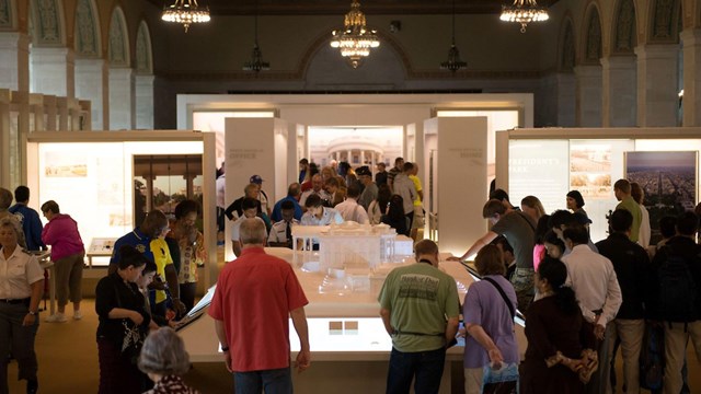 Visitors roam about in the main hall of White House Visitor Center.