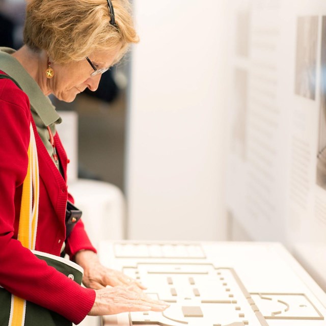 Women touching tactile map