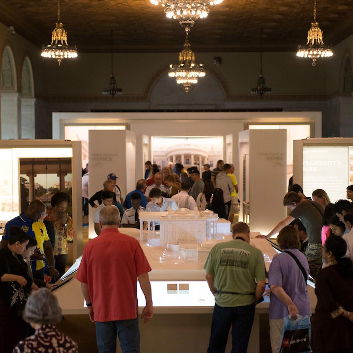 Visitors roam about in the main hall of White House Visitor Center.
