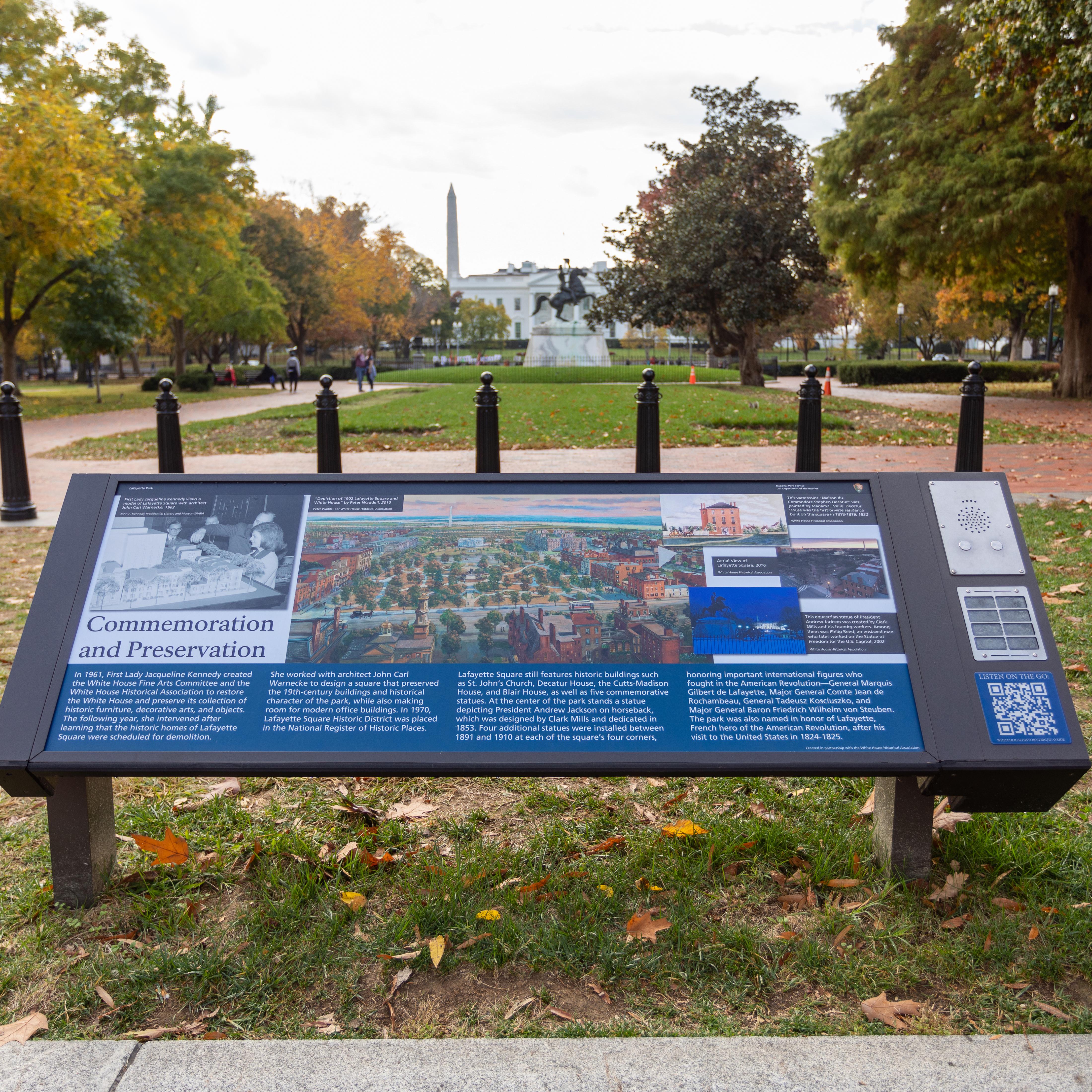 View of information panel in the foreground with White House in background