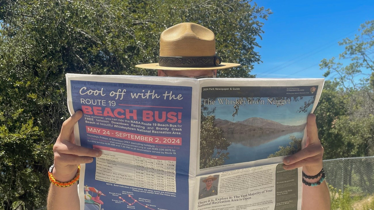 Park Ranger reading the Whiskeytown Nugget