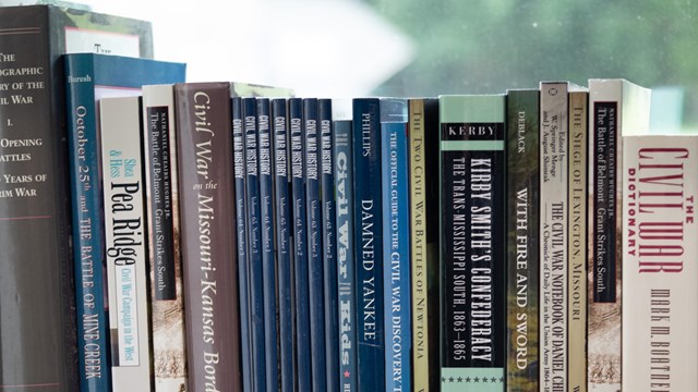Books about the battle at WIlson's Creek and the Civil War lined up on a shelf. 