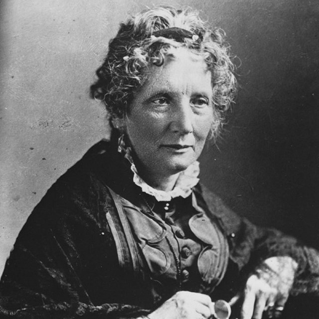 Black and white portrait of a white woman with short gray hair