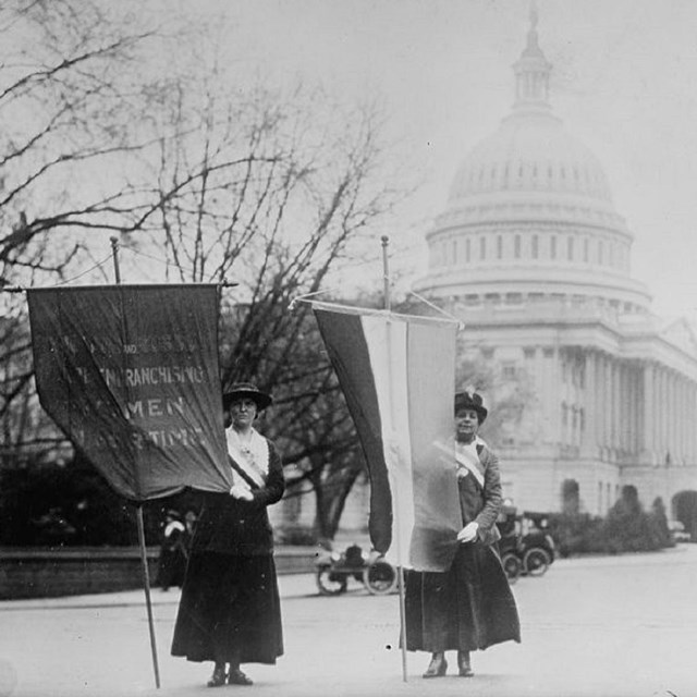 Black and white photo of women picketing near Capitol Building, Library of Congress. 