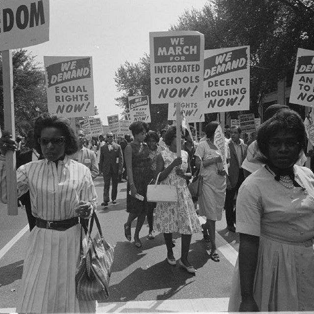 African Americans protesting and holding signs. LOC. 