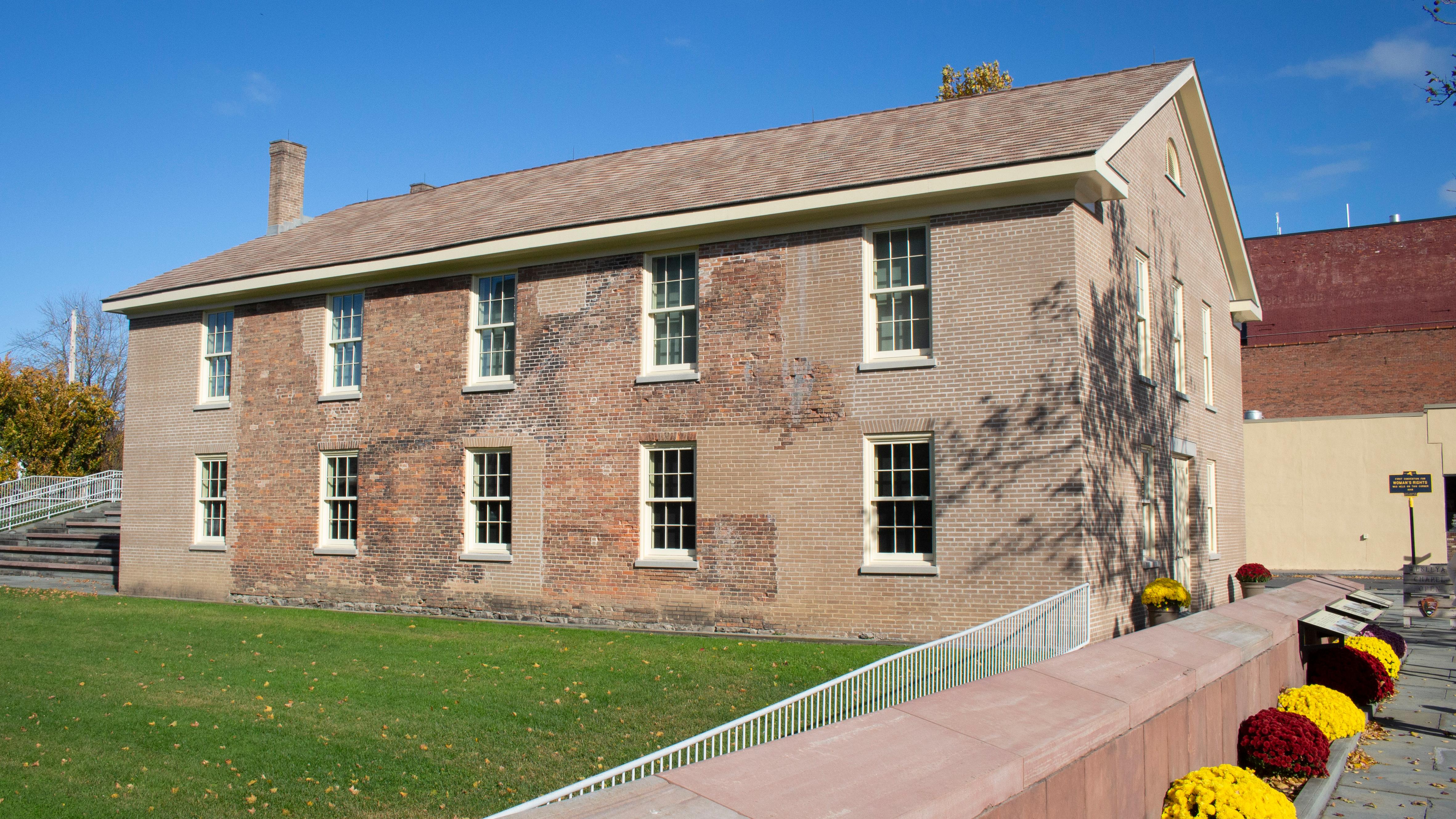 The exterior of the Wesleyan Chapel, with flowers out front.