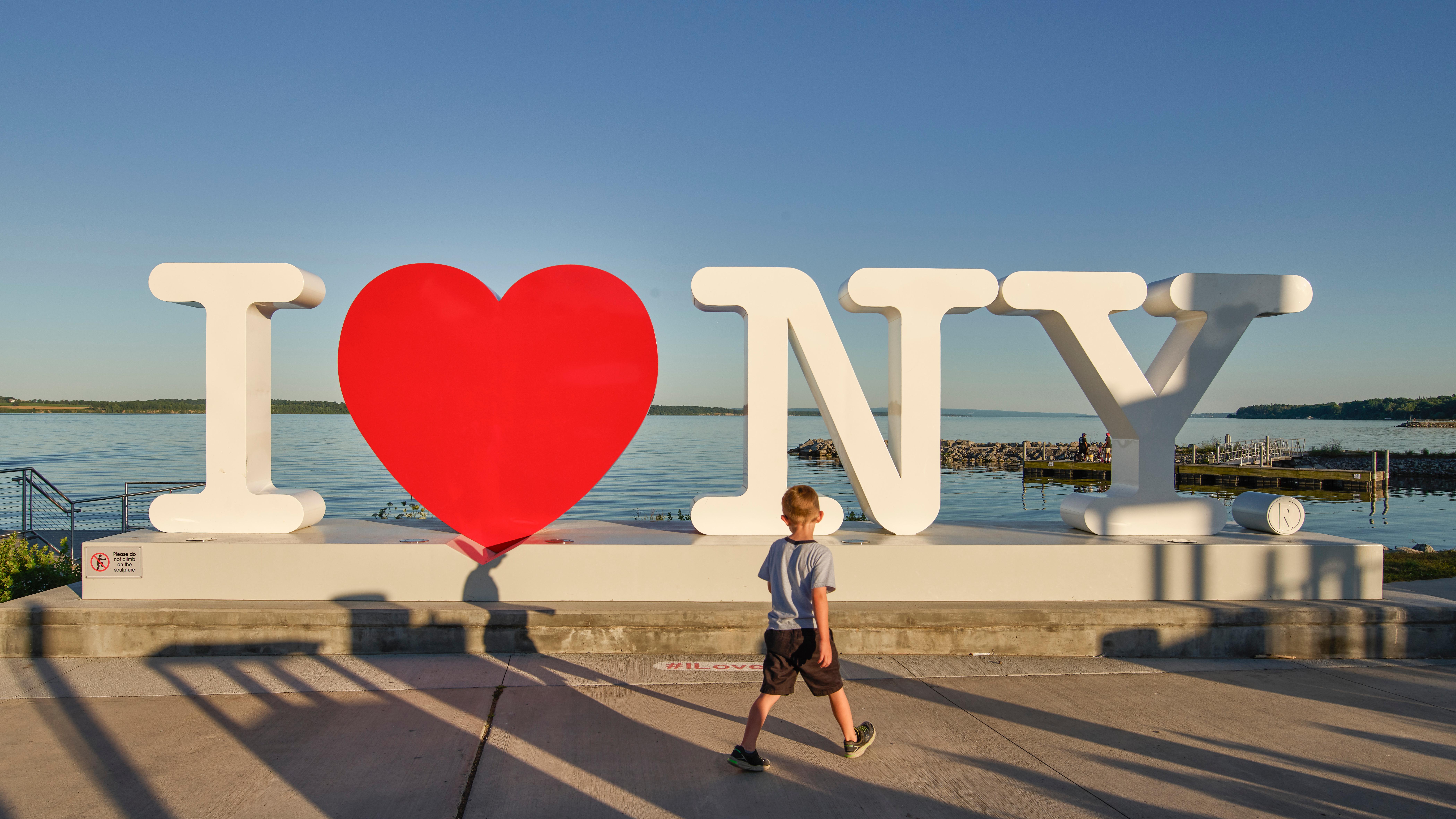 A large sculpture of the "I Heart NY" logo