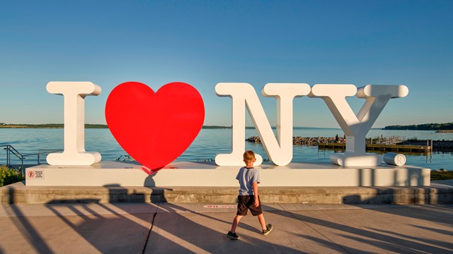 A large sculpture of the "I Heart NY" logo