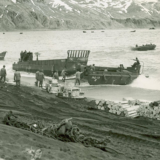B&W of WWII military boats coming ashore