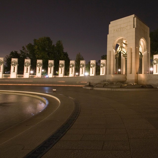 nighttime view of memorial with fountains