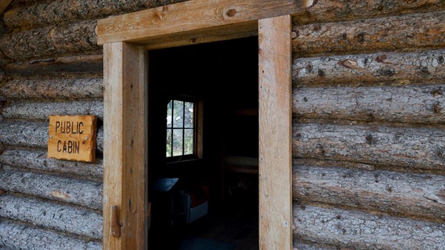 The door to a wooden cabin.