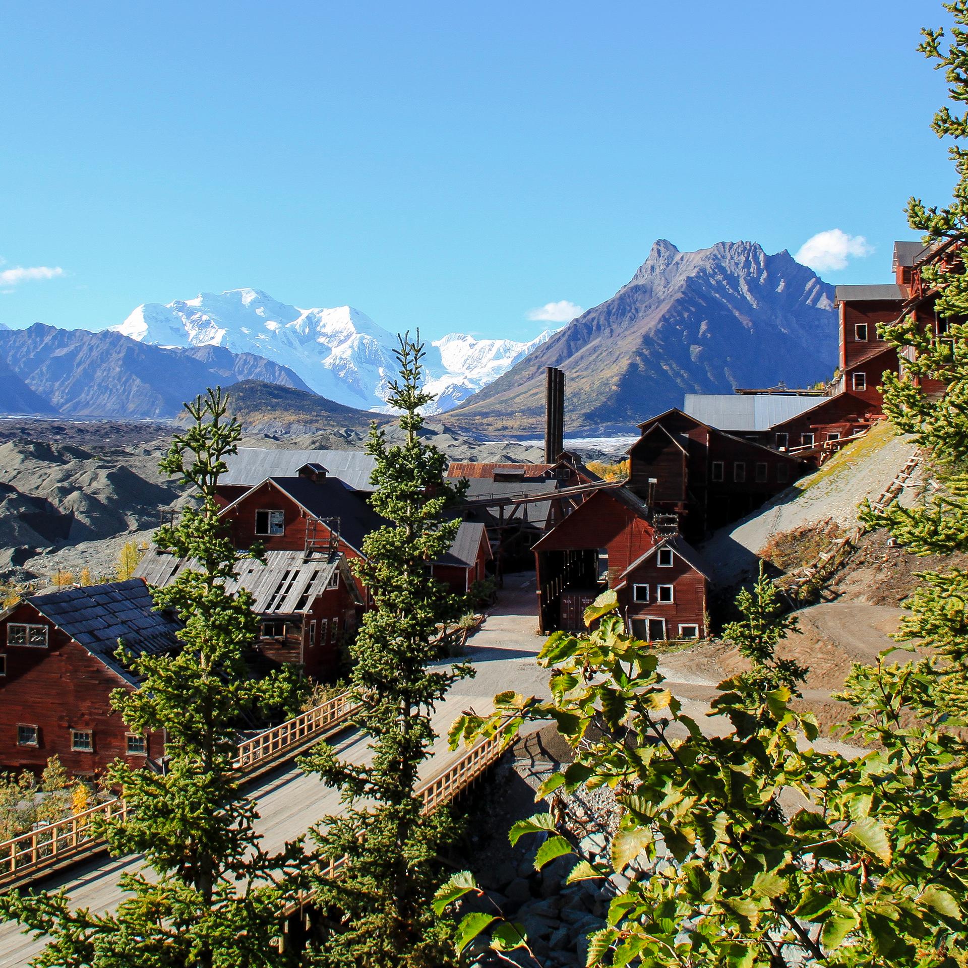 A view from above the Kennicott Processing Mill with Mountains and Glaciers surrounding them.