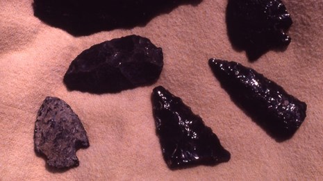 Black obsidian arrowheads and other artifacts collected in Norris Geyser Basin area