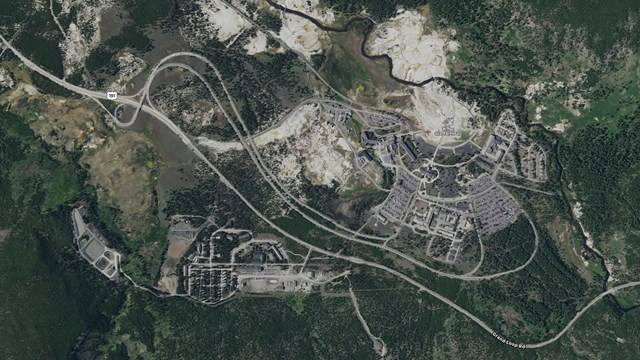 Satellite view showing the main roads and facilities around Old Faithful Geyser.