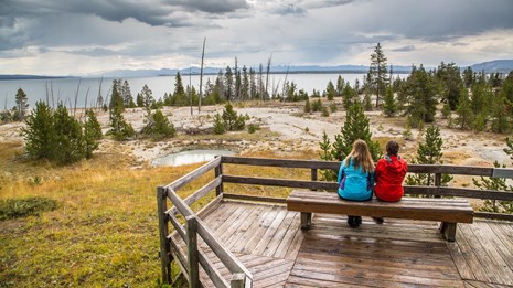 People enjoying the views at the West Thumb Geyser Basin.