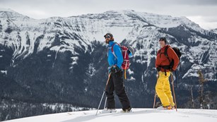 Two skiers explore the mountains of Yellowstone.