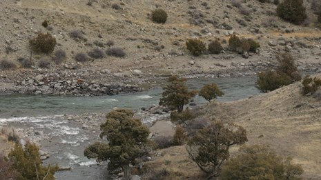 The convergence of two rivers in a steep-sided river valley.