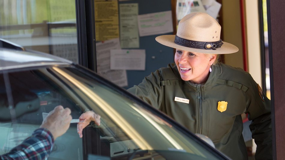 Photo of a park ranger at an entrance station