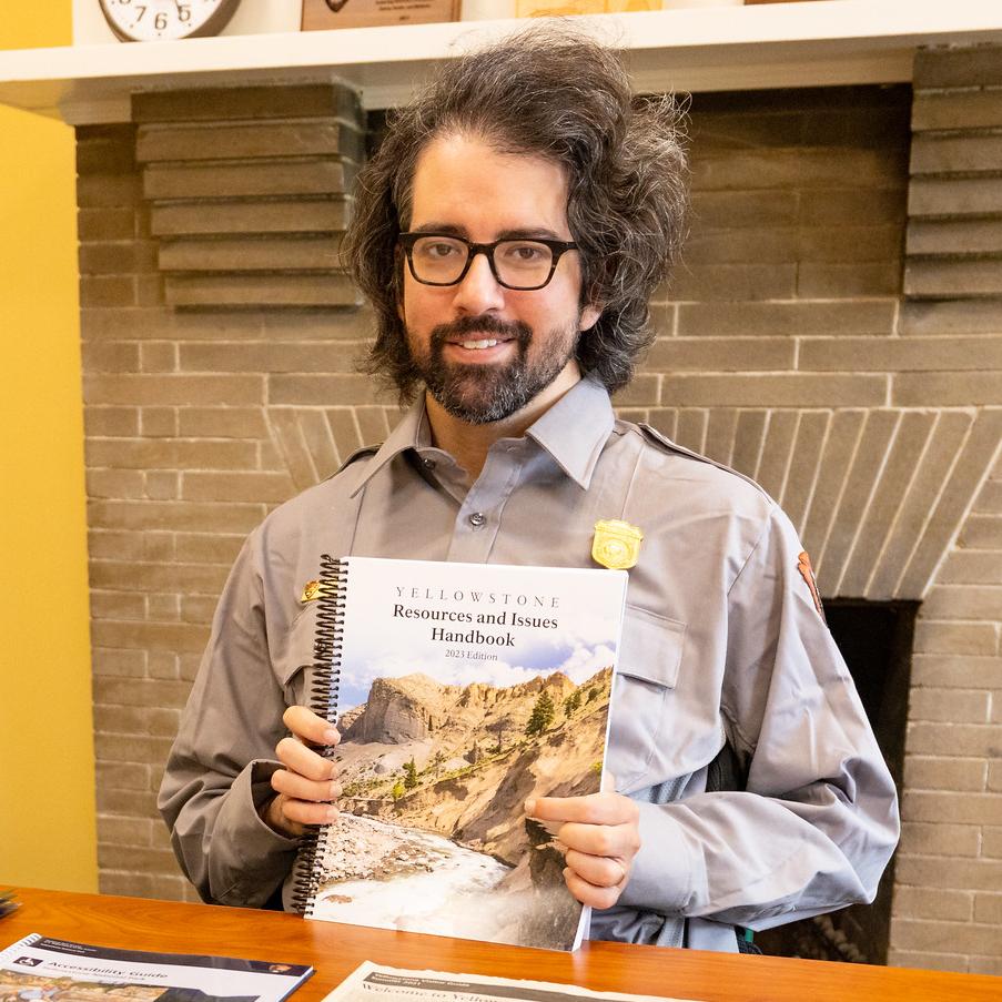 Ranger holds a copy of the Resources & Issues publication