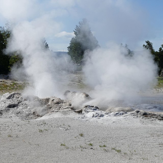 Steam rises from the built-up cone of Jet Geyser.