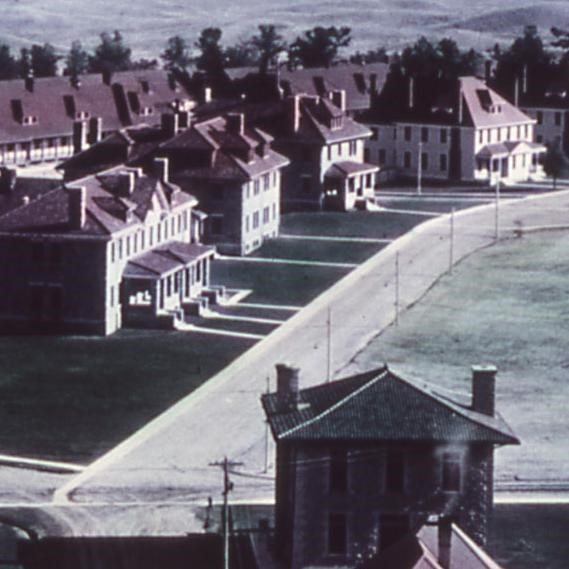 Historic photograph of Fort Yellowstone showing the red-roofed buildings of Officer's Row.