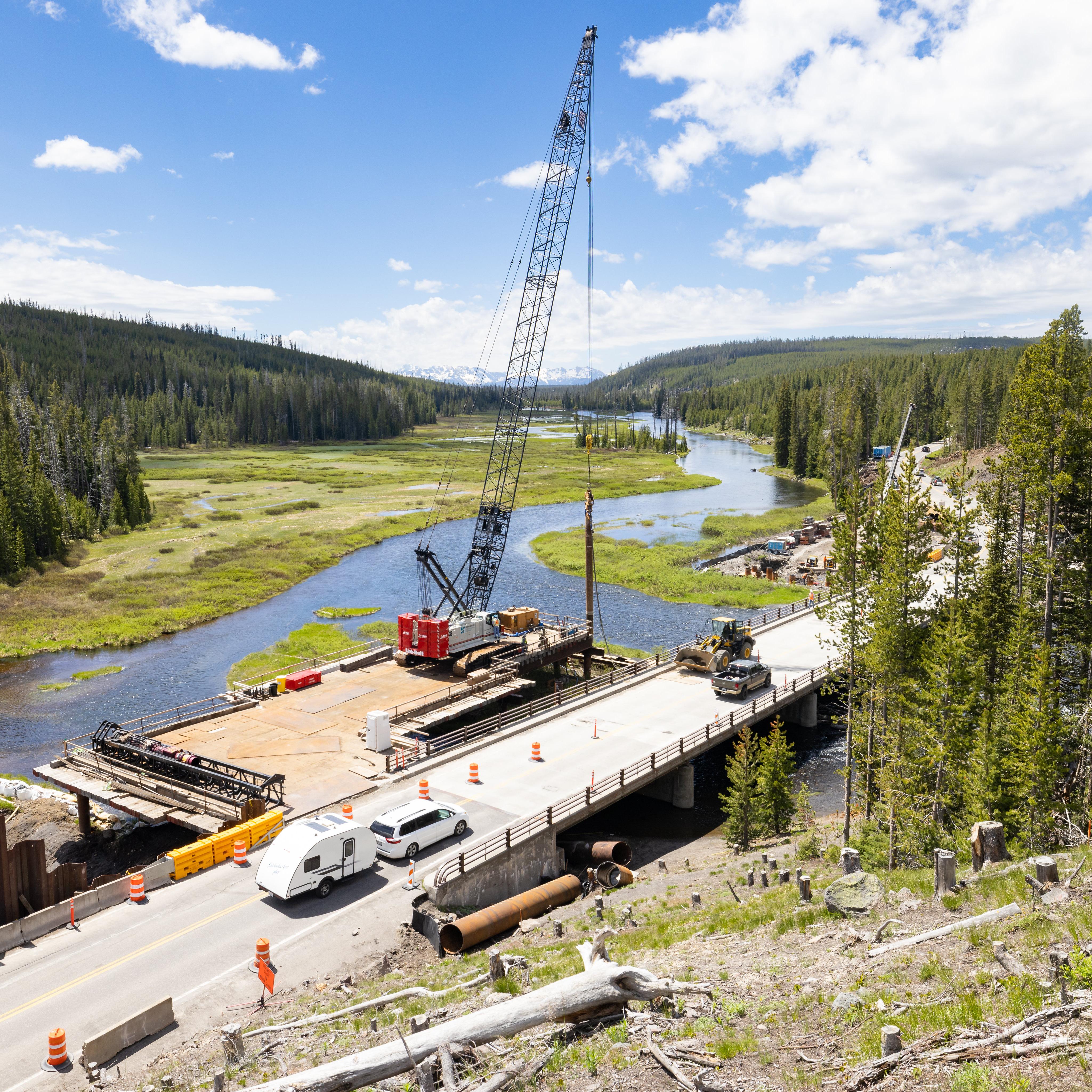 a construction site at a bridge over a river
