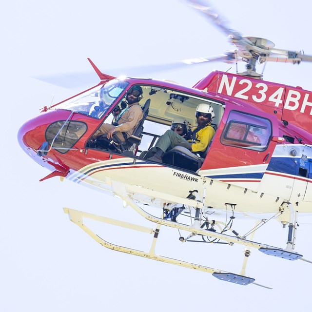People in a helicopter during flight
