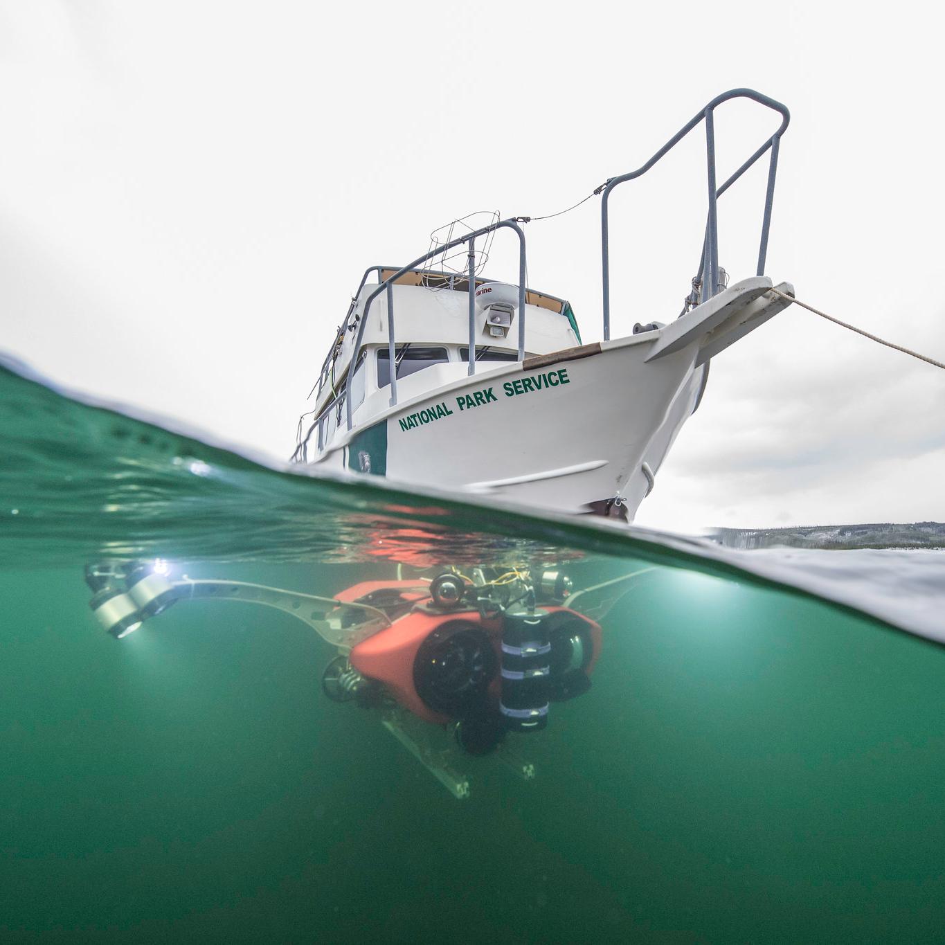 An NPS boat seen above a submersible in the water