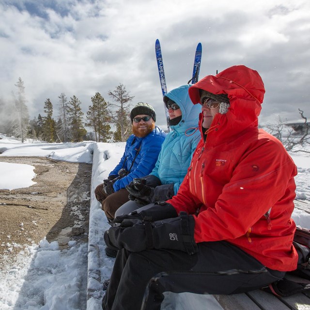 People bundled up while waiting for an eruption of Grand Geyser.