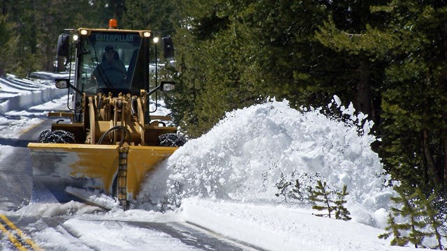 Snowplow plowing snow