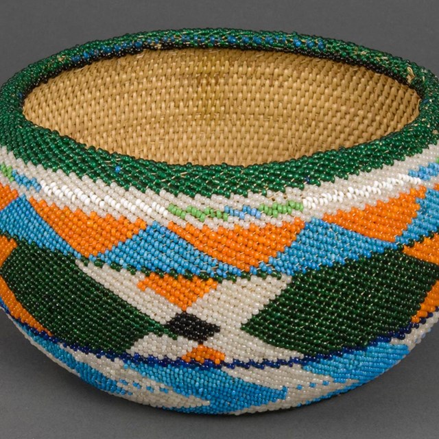Colorful beaded basket made by Amy Rhoan, ca. 1930.
