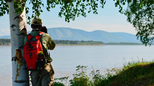 A photographer taking photos on the Yukon River
