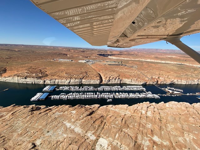 Lines of boats in a narrow canyon