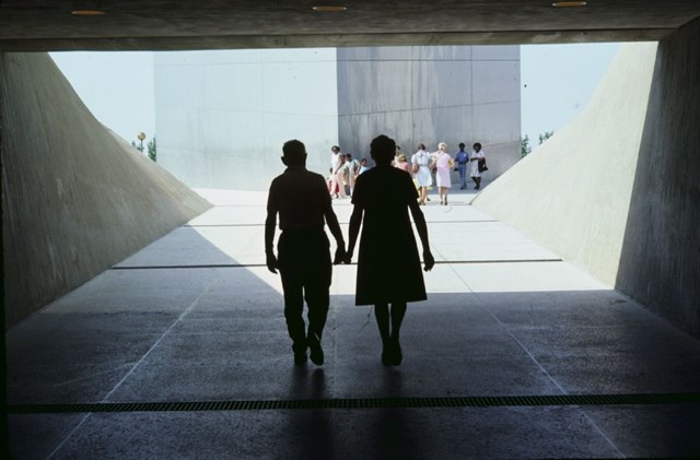 Visitors on entrance ramp to Gateway Arch.