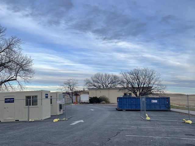 Visitor Center with large dumpsters. 