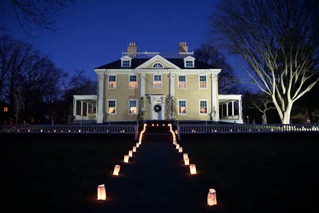 Historic house at night with illuminated front path