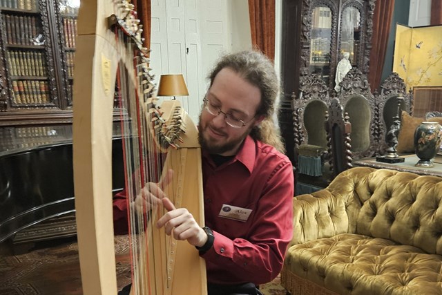 Harp player in the historic Longfellow library
