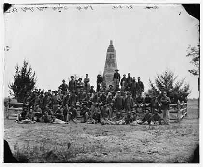 Civil War Photograph of soldiers standing around the Patriots Monument