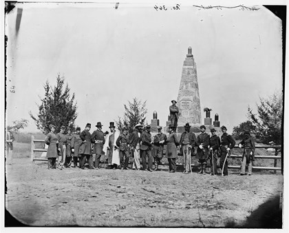 Civil War Photograph of Officers and Civilians standing in front of the Patriots Monument