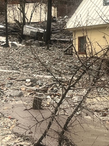 Several yellow structured in deep rocks, mud, and other debris.