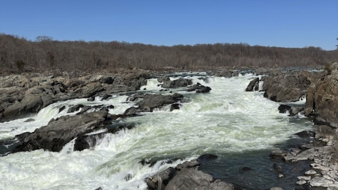 Rocky terrain with water rushing through in winter 