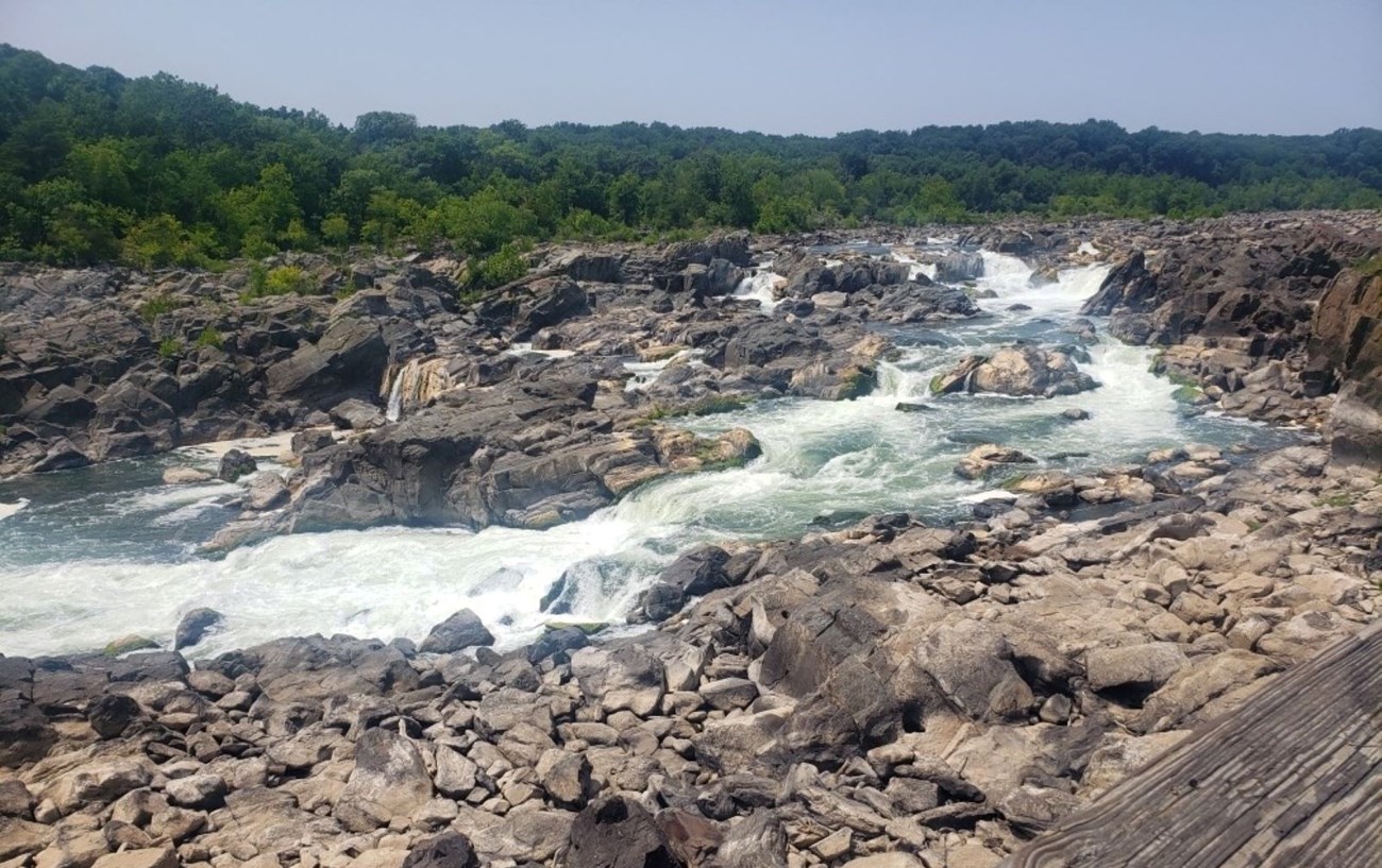 Rocky terrain with water rushing through 