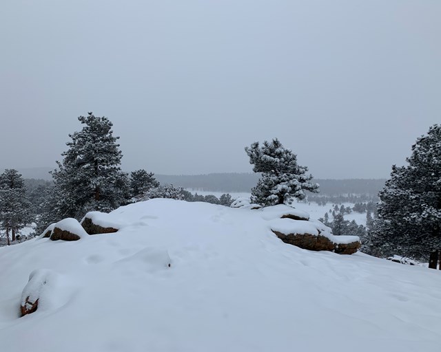 Rock outcropping covered in snow.