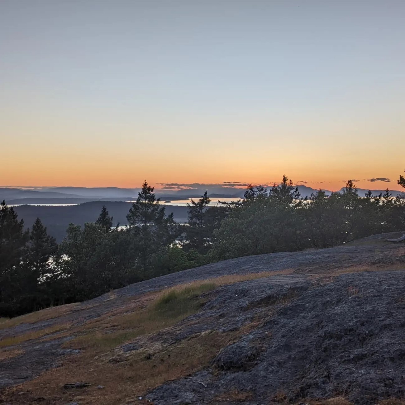 Distant islands and mountains seen from the top of a mountain